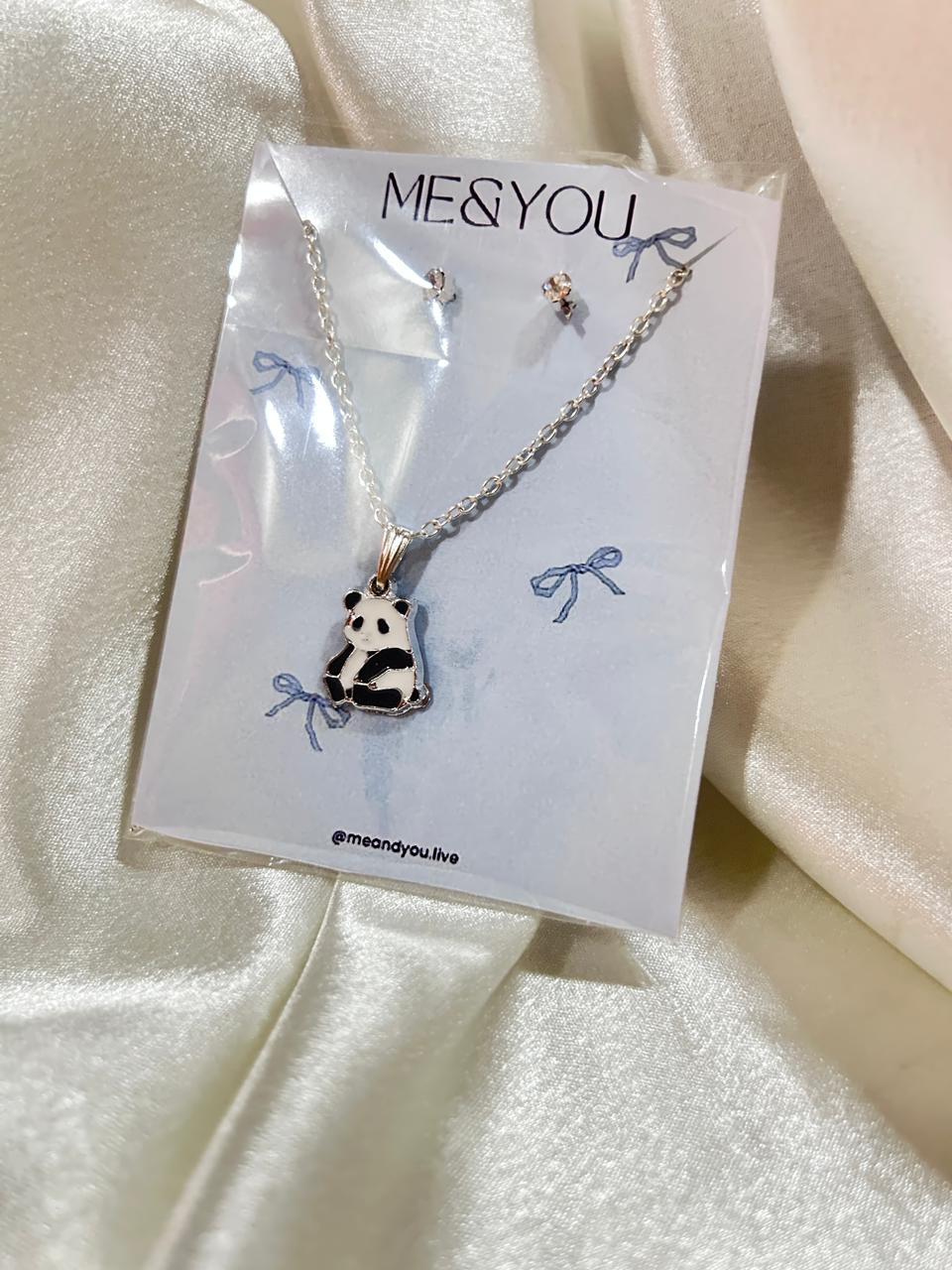 Necklace with panda pendant on a 'Me & You' branded card against a satin background